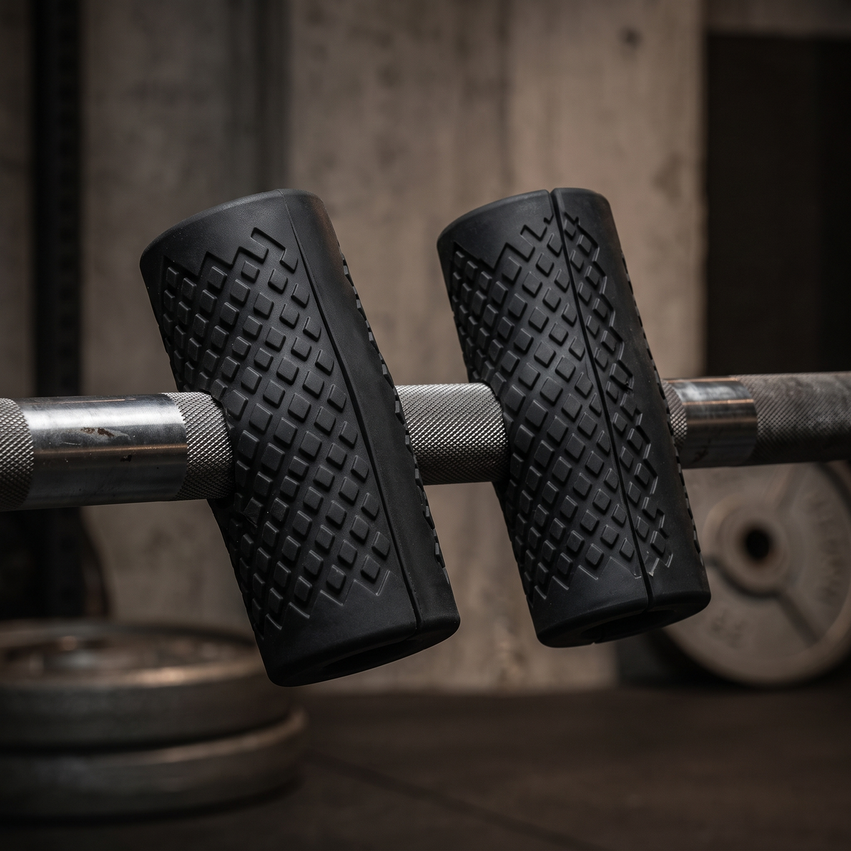 Fat grips wrapped around a barbell