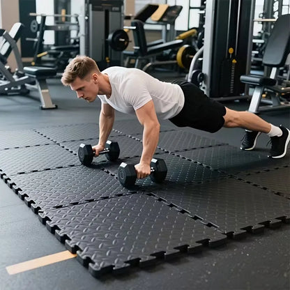 Black interlocking EVA foam gym floor tiles in a home gym