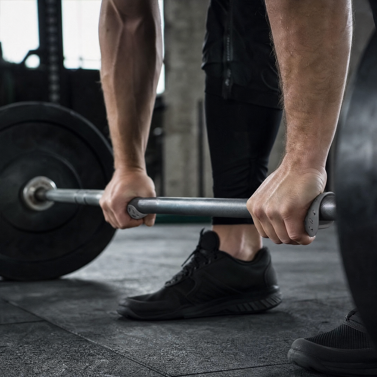 Silicone grip pads on a deadlift barbell