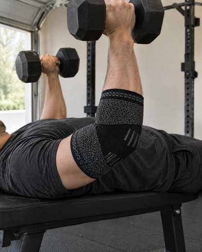 Elbow Compression Sleeve worn during a dumbbell press