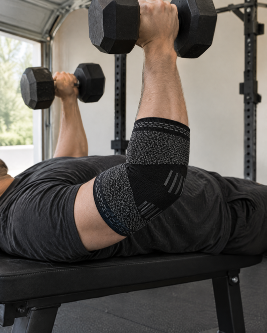 Elbow Compression Sleeve worn during a dumbbell press