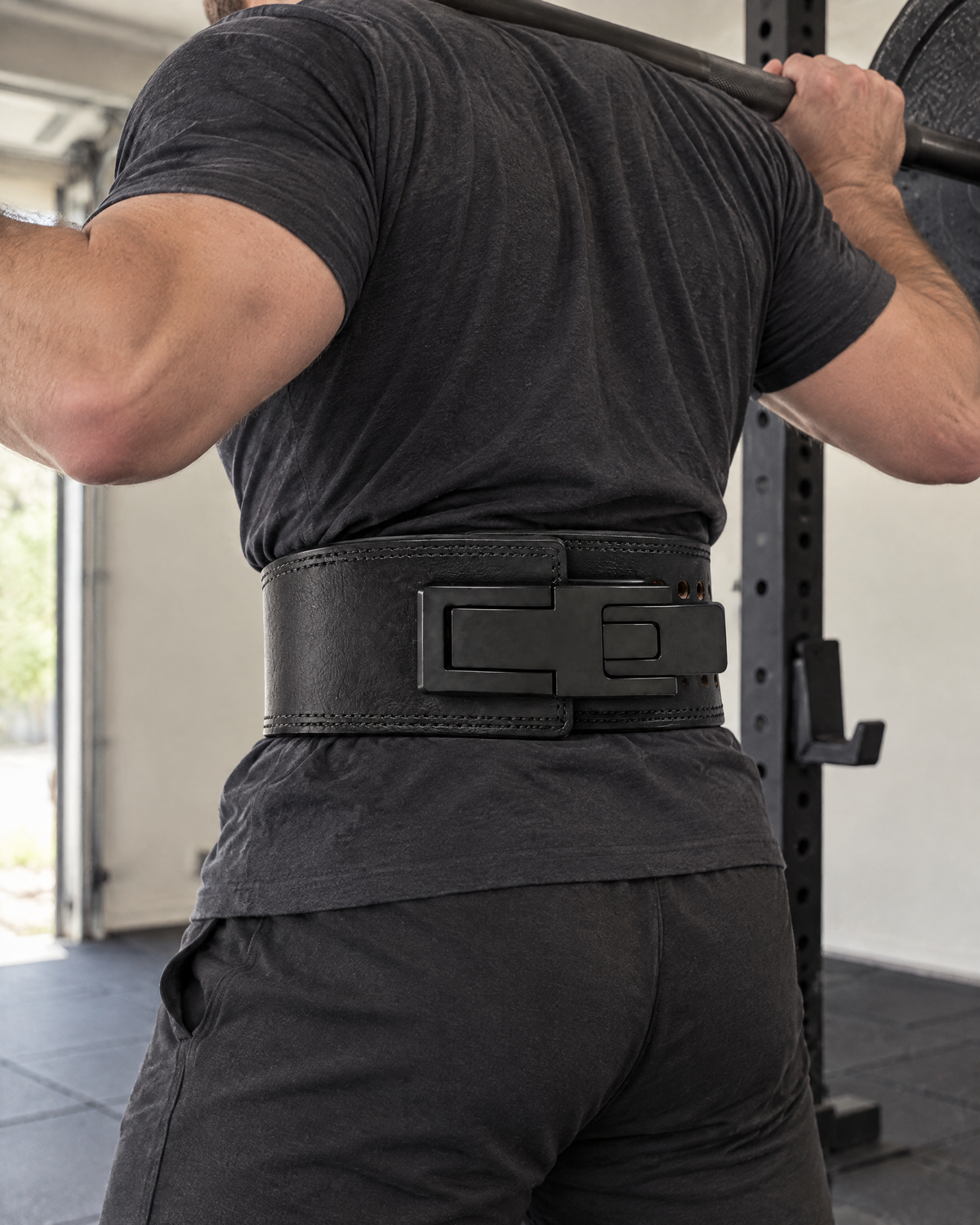 Leather Lever Lifting Belt worn for squats in a home gym