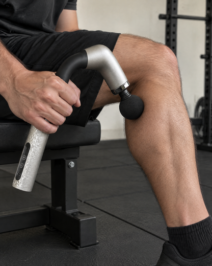 Percussion Massage Gun in use on the calf