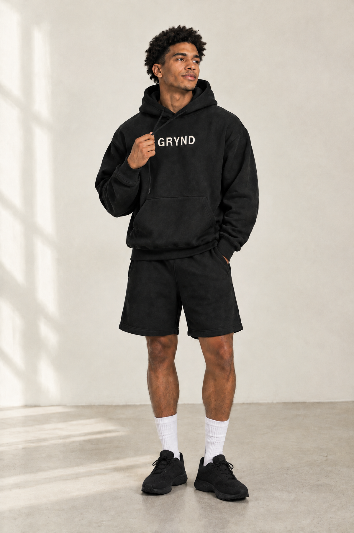 Back of a black GRYNDWEAR hoodie