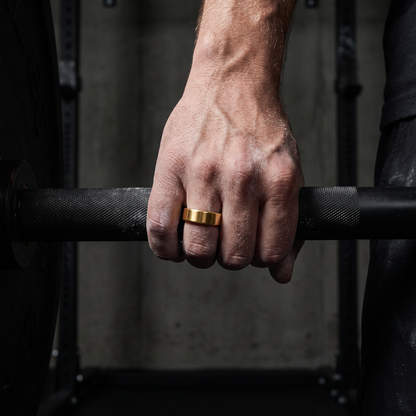 Smart ring worn on a lifter's finger gripping a barbell